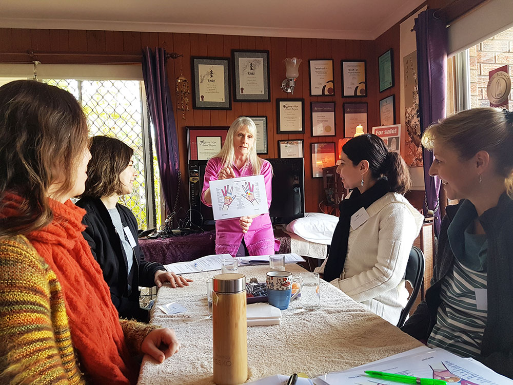 Deb teaching hand reflexology